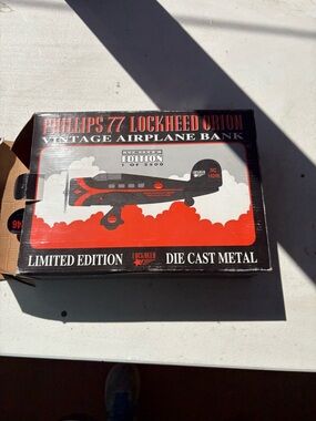 Lockheed Orion Vintage Airplane Bank - Black & Red